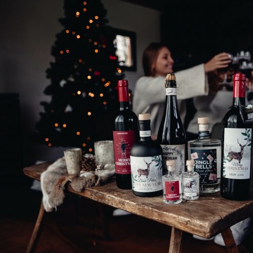 Banner kerstflessen op tafel als kerstcadeau